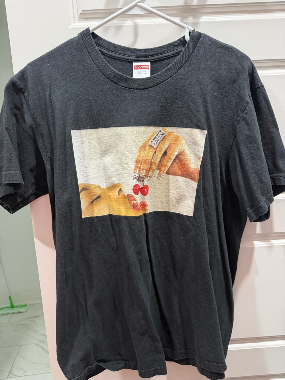 Supreme Black Graphic Tee with Red Cherry Motif